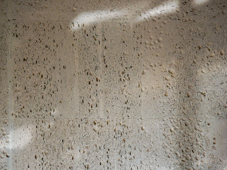 Texture Sandstone wall spots of light and shadow