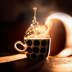 Christmas tree made with steam and bokeh of hot drink in cup . Creative winter holidays. Cozy home