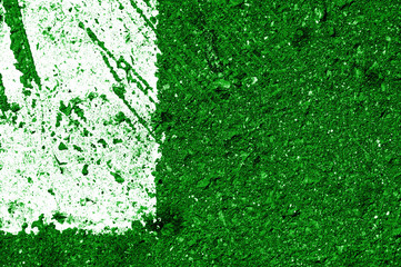 Old asphalt surface with white paint close-up, top view. Abstract background. Green color toned