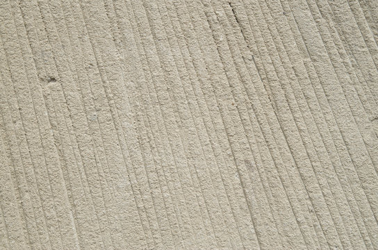 Processed sandstone with parallel lines closeup