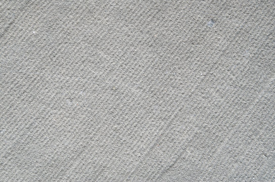 Processed sandstone with parallel lines closeup