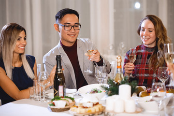Friends at holiday table.