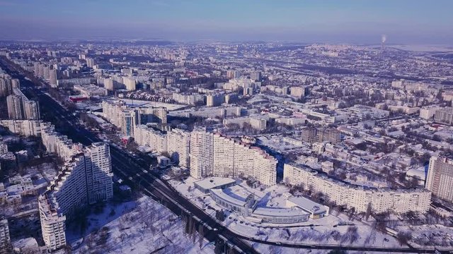Top view of city in winter at sunset on sky background. Aerial drone videography concept. 4K. Kishinev, Republic of Moldova.