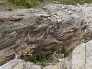 Limestone and rock piles at a coastal area in Jamestown, Rhode Island.