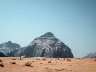Fototapeta na wymiar Rocky outcrops in the desert of Wadi Rum in the morning
