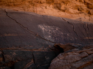 Ancient paintings on a rock in the desert of Wadi Rum