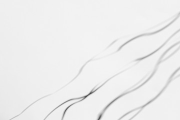 Organic drop diagonal shadow on a white wall, overlay effect for photo and mockups