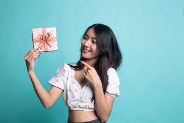 Young Asian woman with a gift box.