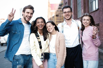 Group of young people having fun together outdoors