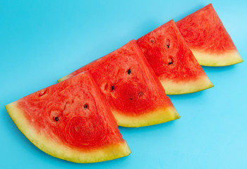 Ripe red watermelon isolated on a blue background