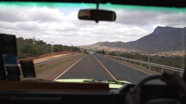 Driving on A109 Nairobi-Mombasa road. Ride in car on Chinese built national street from Nairobi to Mombasa. China builds infrastructure in Kenya, Africa. Time lapse.