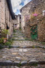 Rustic street in the medieval village of Evol in the French Pyrenees