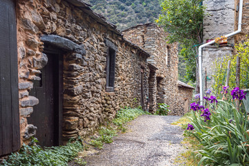 Rustic street in the medieval village of Evol in the French Pyrenees