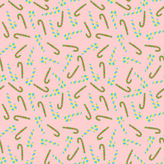 Candy canes seanless pattern on pink background. Textile and paper design.