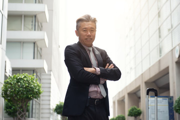 asian senior business male with office background