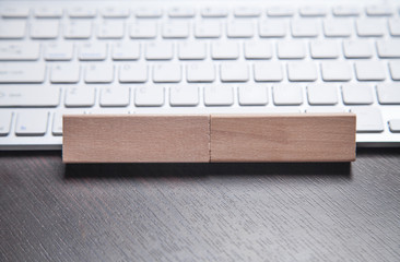 Wooden blocks on the computer keyboard.