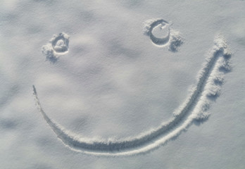 finger smile on white snow