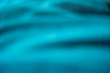 Blur blue silk fabric texture abstract background.