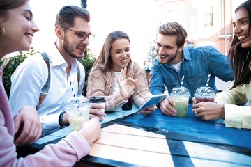 Group Of Friends Drinking Cocktails At Outdoor Bar