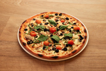 tasty delicious pizza food on a wooden background