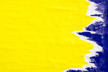 Yellow and blue crumpled, ripped and peeling paper placards with dirty traces of glue texture...