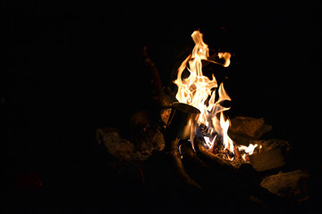 Fototapeta premium Closeup of blazing campfire coals in the evening