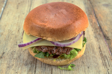 beef burger on a wood table