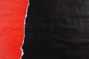 Red and black torn and peeling gloss paper posters with traces of glue texture background.