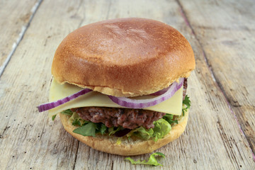 beef burger on a wood table