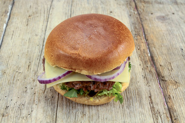 beef burger on a wood table
