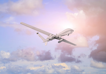Spy unmanned aerial vehicle (UAV) flies over white clouds in blue sky natural background on sunset