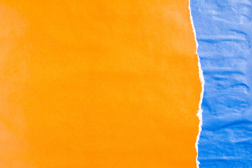 Blue and orange crumpled torn gloss paper posters texture background. Can be used for text.