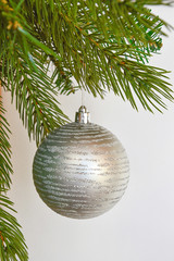 Decor for a happy Christmas and New year. Silver color. Christmas tree balloon on white background. happy winter holidays. Background for congratulations. Grey balls for Christmas tree decoration. And