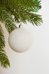 Decor for a happy Christmas and New year. Silver color. Christmas tree balloon on white background. happy winter holidays. Background for congratulations. White balls for Christmas tree decoration. An