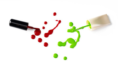 Drops of spilled nail polish over white background