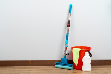 Cleaning tools for house cleaning on wooden floor