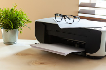 Close up of an office table with printer on it
