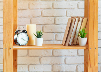 Wooden rack shelf with home decor stuff