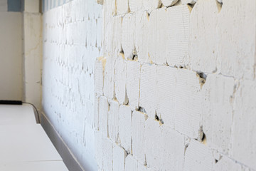 Rough old white wall with cracks for a background