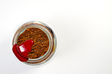 Natural cork in a glass bottle sealed with red sealing wax filmed on a large white background