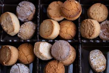 Variety of Spanish shortbreads Mantecados, polvorones, nevaditos in black box. Typical sweets consumed at Christmas time in Spain.