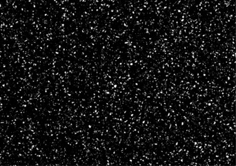 Small uneven spots and particles of debris. Abstract vector texture.  Distressed uneven background. Grunge texture overlay with fine grains isolated on white background. Vector illustration. EPS10.