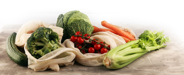 eco natural bags with vegetables, eco friendly, flat lay. sustainable lifestyle concept. zero waste vegetables shopping. plastic free items. reuse, reduce, recycle, refuse