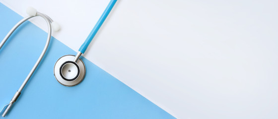 close up of stethoscope on white and blue background     