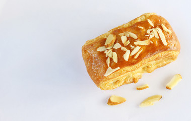 bakery bread with almond isolated on white background.