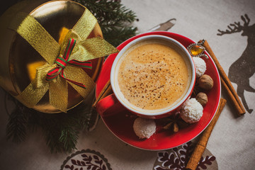 Cozy Christmas cup of coffee, magic evening at home. Scene of holidays detail