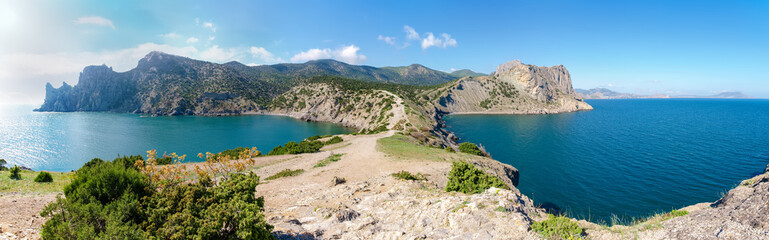 Wide panorama of the rocky sea coast from the cape