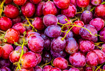 Dark grape close-up background. Ripe red grape close-up, pattern. Fruit background, veggie concept, fruit menu, healthy lifestyle