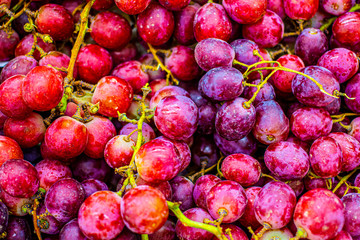 Dark grape close-up background. Ripe red grape close-up, pattern. Fruit background, veggie concept, fruit menu, healthy lifestyle