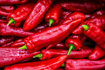 Red chillies close-up background. Ripe red peppers close-up, pattern. Vegetable background, veggie concept, fruit menu, healthy lifestyle